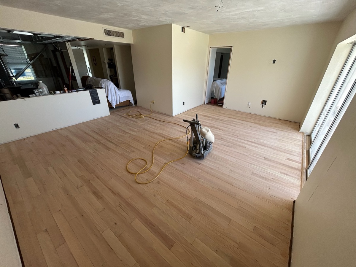Living room hardwood floor being sanded