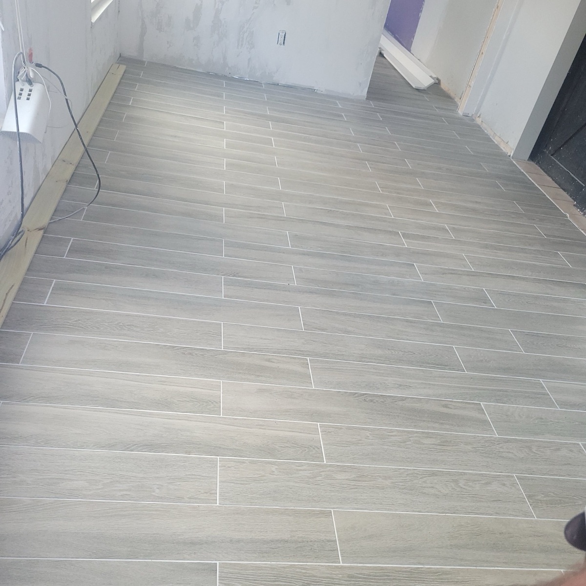 Gray wood-look plank tile flooring