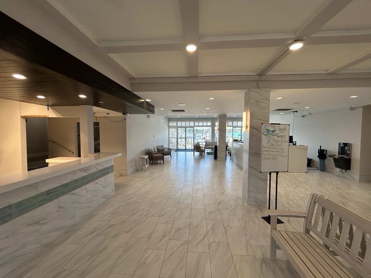 Completed basement renovation with island and flooring