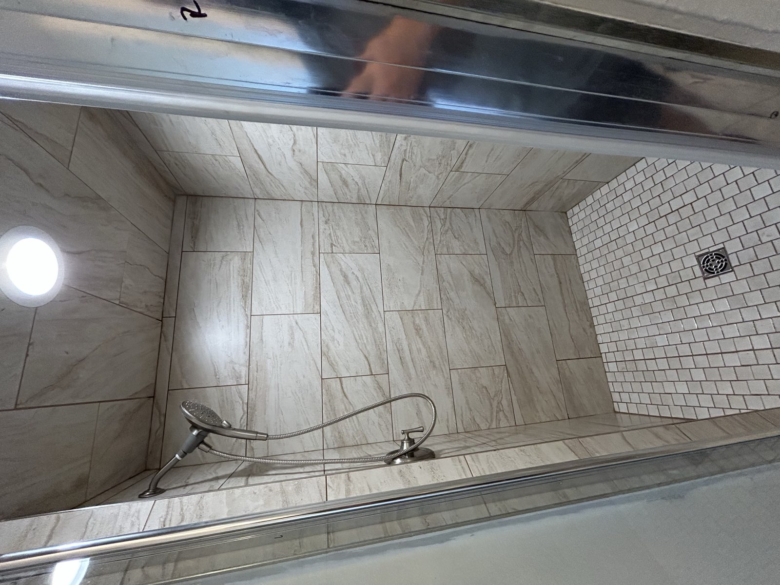Custom luxury shower remodel with large-format tile and frameless glass