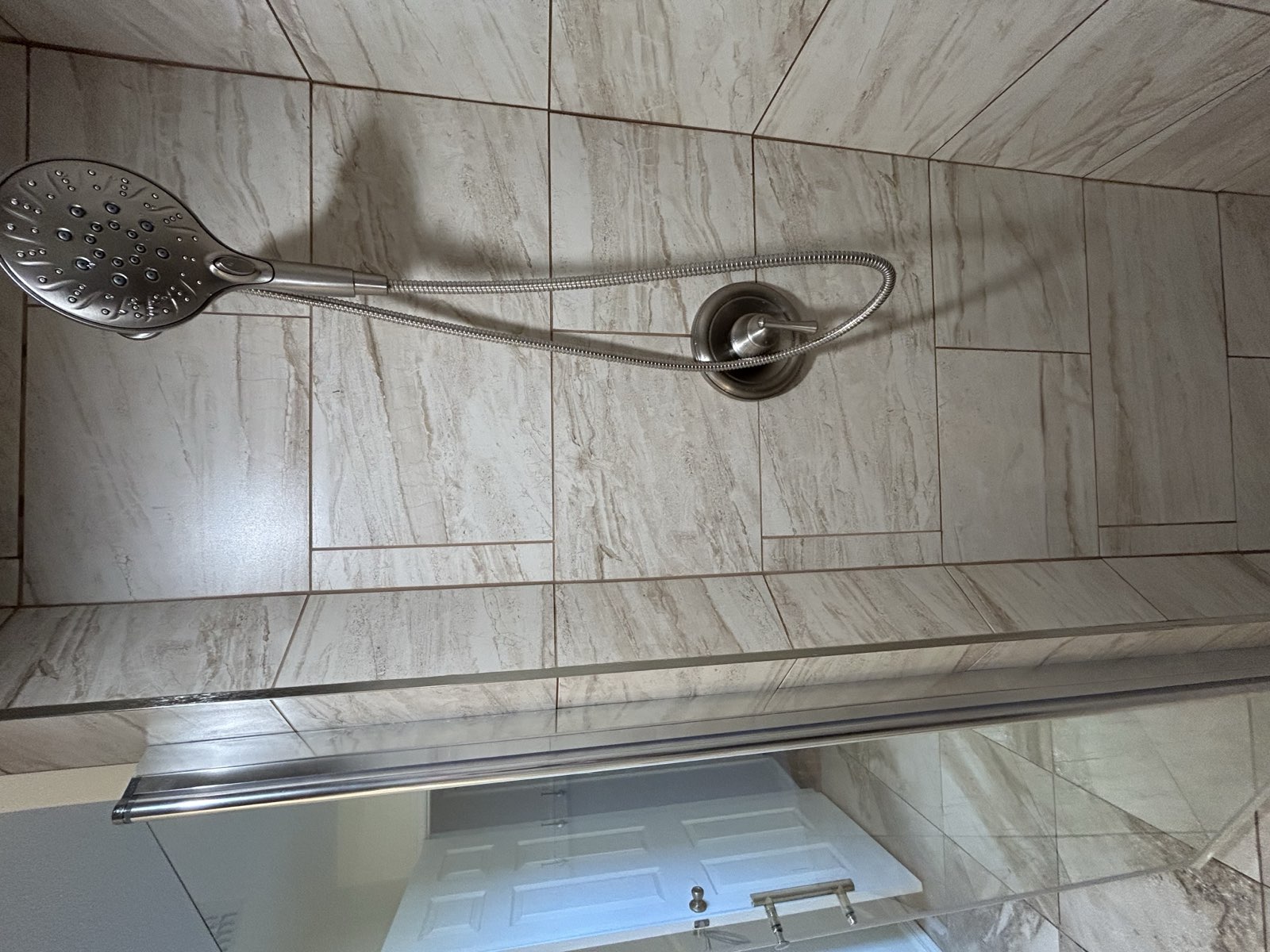 Completed walk-in shower with modern tile work