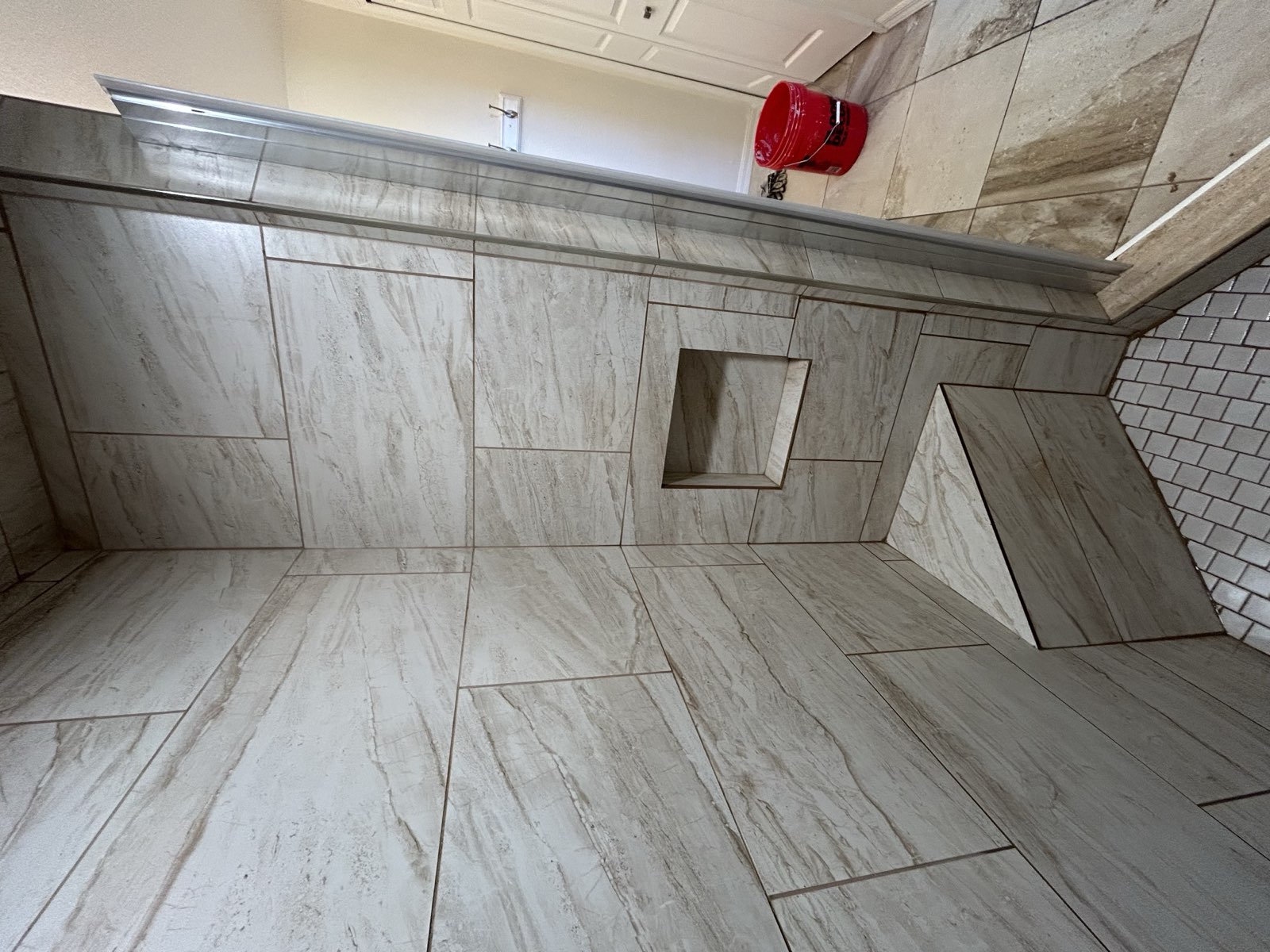Custom shower with premium fixtures and tile